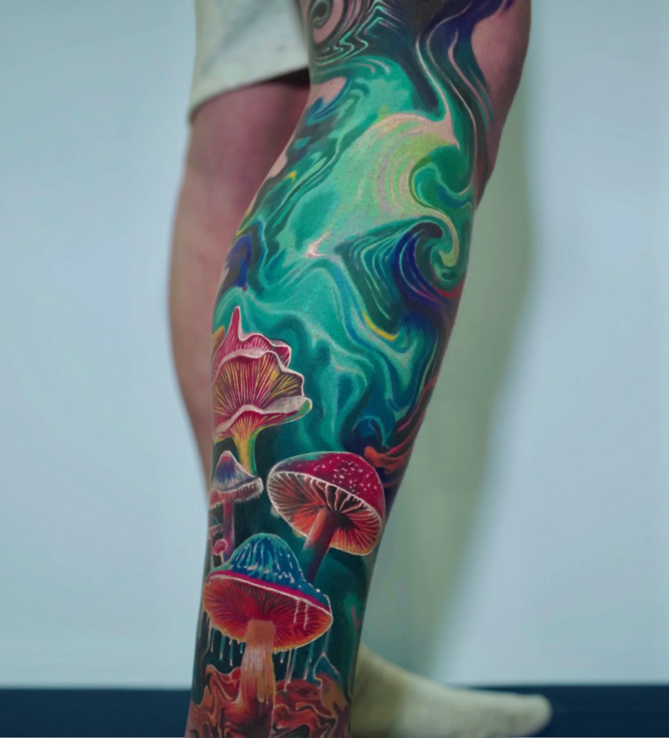 Stoned Ape Theory full leg tattoo by Churchill