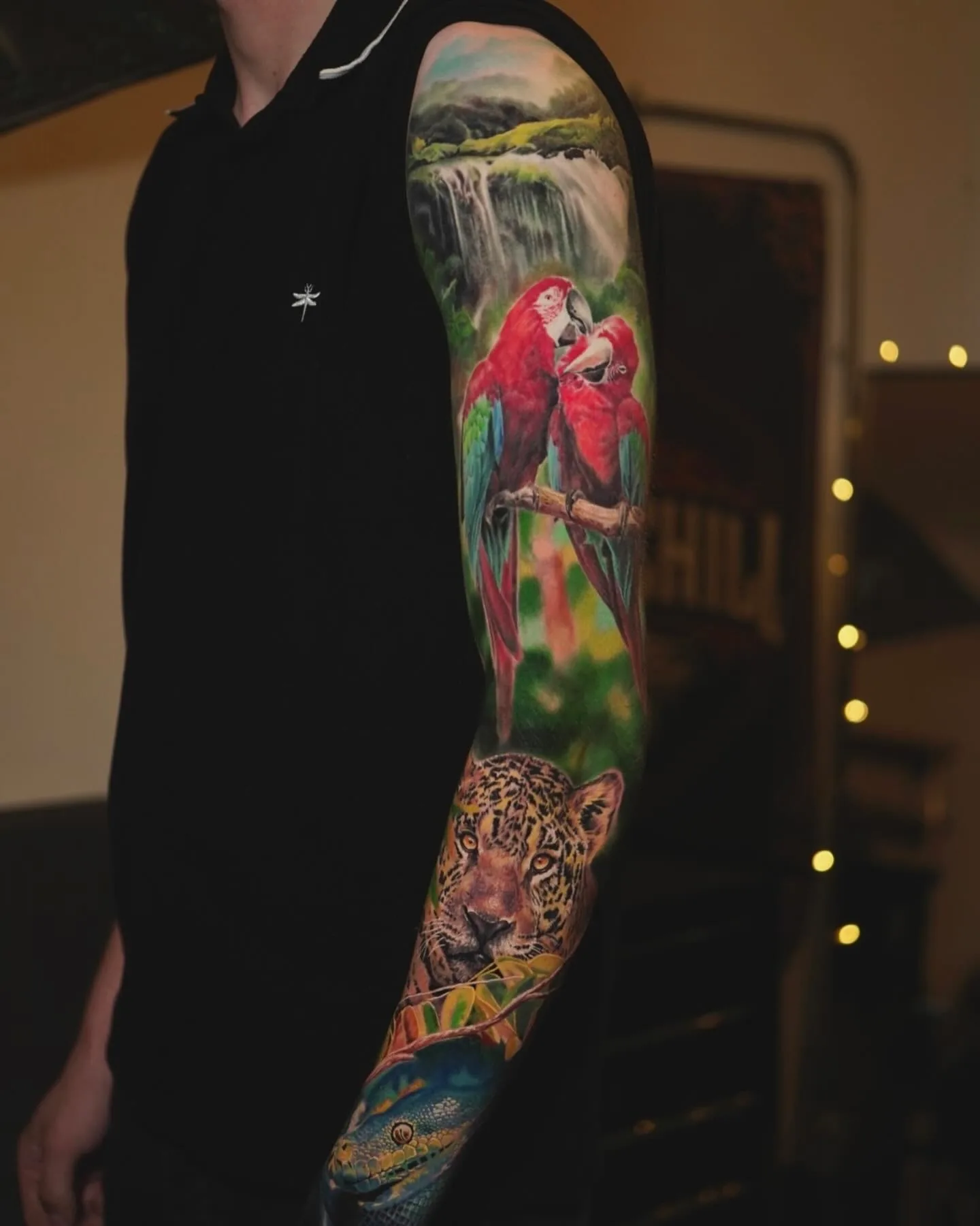 Rainforest Wildlife full sleeve tattoo by Churchill
